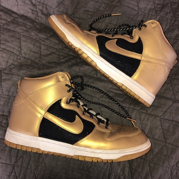 gold and black nike high tops